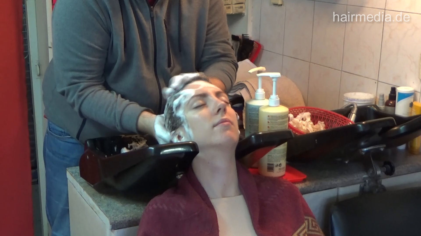 6207 Jana 1 backward salon shampooing hair and ear by barber