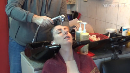 6207 Jana 1 backward salon shampooing hair and ear by barber