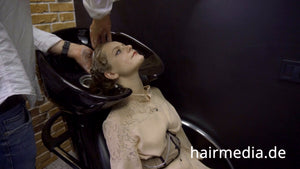 8169 Marianna teen shampoo and haircut in black laquer vinyl push button cape