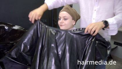 8169 Marianna teen shampoo and haircut in black laquer vinyl push button cape