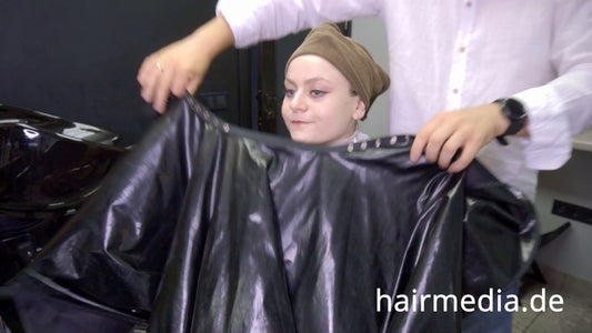 8169 Marianna teen shampoo and haircut in black laquer vinyl push button cape