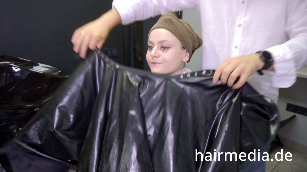 8169 Marianna teen shampoo and haircut in black laquer vinyl push button cape