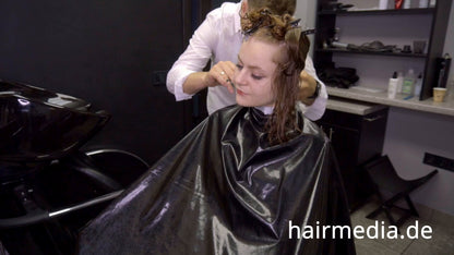 8169 Marianna teen shampoo and haircut in black laquer vinyl push button cape