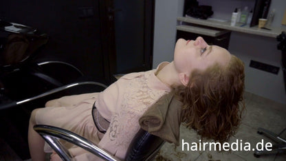 8169 Marianna teen shampoo and haircut in black laquer vinyl push button cape