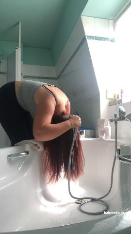 9000 AmeliaS curvy redhead self shampooing forward over tub at home