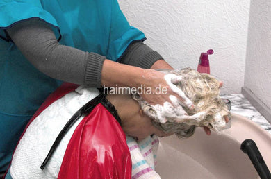 198 Amalia long blonde hair in salon 2 forward hairwash by mom in dederon apron using heavy shampoocape