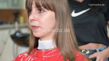 Load image into Gallery viewer, 1171 Liesa 1 dry haircut by Amal in red vinyl cape and neckstrip