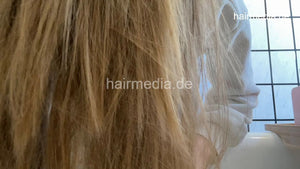 1076 LuisaBe 1 long blonde hair shampooing at home over bath tub forward