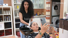 Load image into Gallery viewer, 1171 Meriem 2 backward salon shampoo by Amal in black vinyl cape and neckstrip