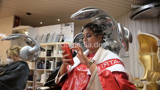 8158 Meriem 4 under the dryer in red pvc cape