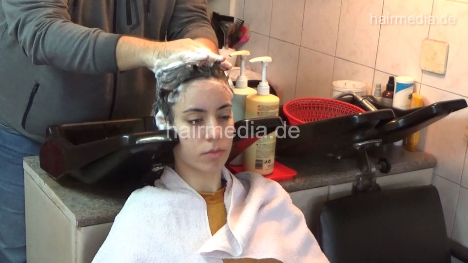 6207 NinaK 1 backward salon shampooing hair and ear by barber