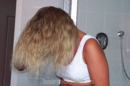 967 Sabine blonde self shampooing at home over bathtub