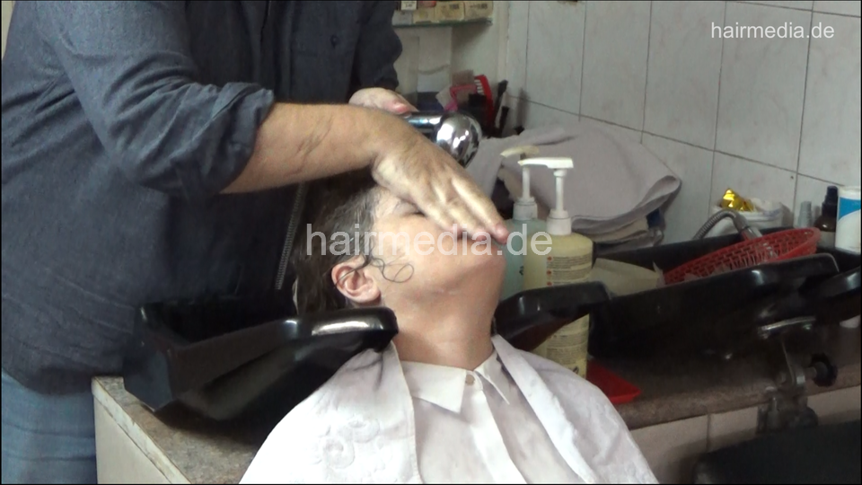 6207 01 Ivana backward salon shampooing hair ear and face by barber