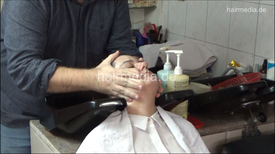6207 01 Ivana backward salon shampooing hair ear and face by barber
