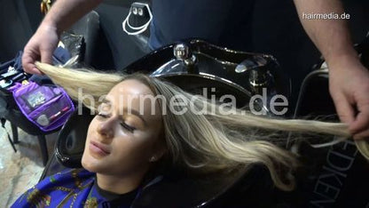 381 Sophie in black salon backward shampooing and haircut by barber
