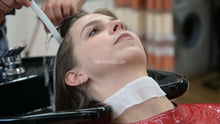 Cargar imagen en el visor de la galería, 1171 Liesa 2 backward salon shampoo by Amal in red vinyl cape and neckstrip