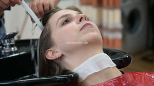 1171 Liesa 2 backward salon shampoo by Amal in red vinyl cape and neckstrip