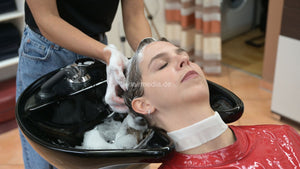 1171 Liesa 2 backward salon shampoo by Amal in red vinyl cape and neckstrip