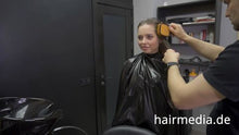 Laden Sie das Bild in den Galerie-Viewer, 8165 Irina braces 2 haircut by Ukrainian barber in RSK leatherdress and black vinylcape complete
