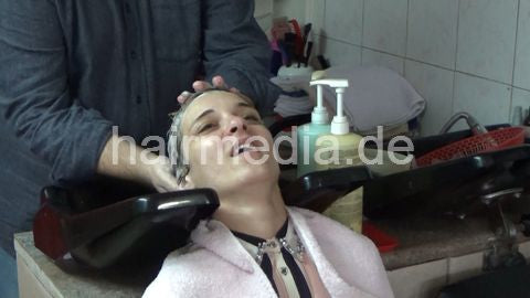 6207 03 Cvetatna backward salon shampooing hair ear and face by barber