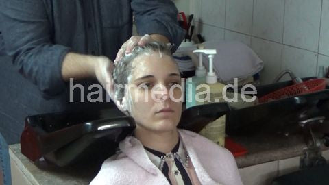 6207 03 Cvetatna backward salon shampooing hair ear and face by barber
