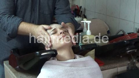 6207 03 Cvetatna backward salon shampooing hair ear and face by barber