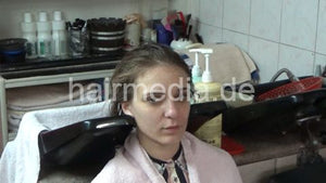 6207 03 Cvetatna backward salon shampooing hair ear and face by barber