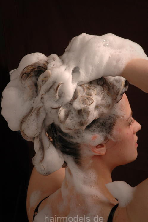 959 TinaJ shampooing in salon room bend over forward bucket