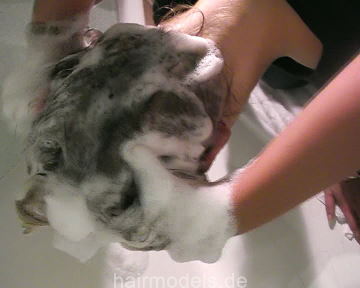 9000 Charlie over the tub shampooing forward with help