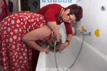 Load image into Gallery viewer, 744 Ingeborg home perm shampoo part at home forward over bathtub