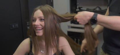 8165 Irina braces 2 haircut by Ukrainian barber in RSK leatherdress and black vinylcape complete