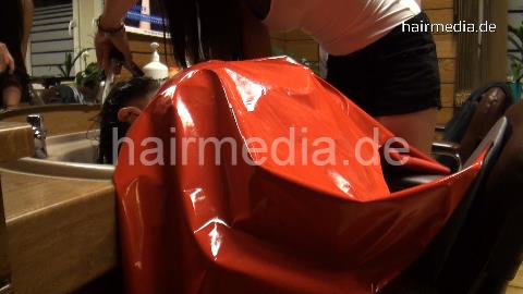 361 Esther 4 conditioner and forward hairwash in red vinyl cape