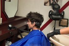 Laden Sie das Bild in den Galerie-Viewer, 294 NadjaZ 05 in black rubber gloves shampooing a guy backward in blue cape and cyan apron