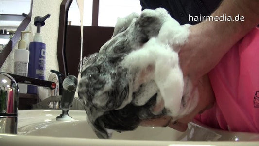 199 3 Melanie forward shampooing by old barber in pvc apron
