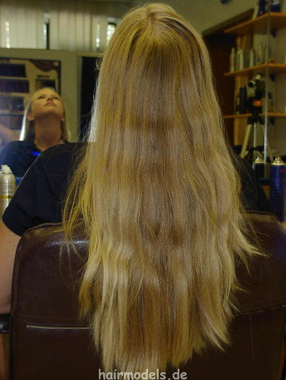 607 long blond hair by young barber shampooing and wet set