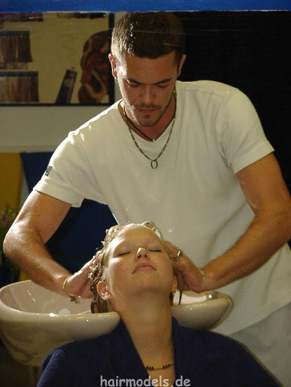 607 long blond hair by young barber shampooing and wet set