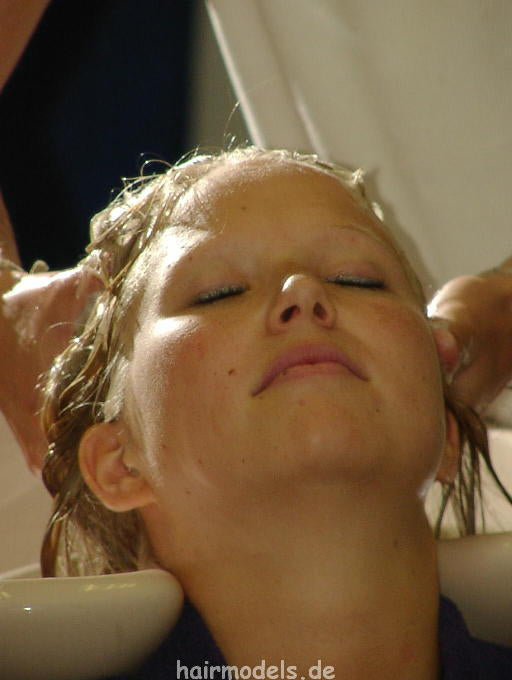 607 long blond hair by young barber shampooing and wet set