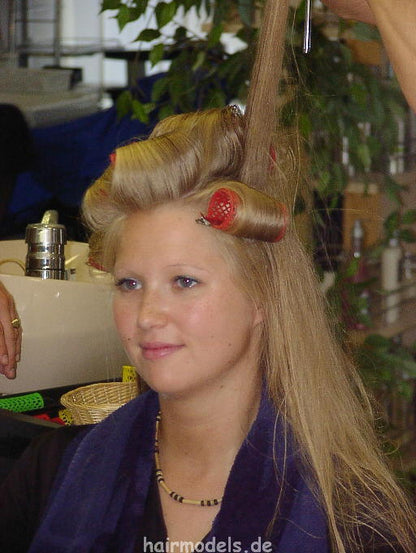 607 long blond hair by young barber shampooing and wet set