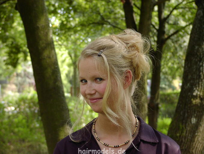 607 long blond hair by young barber shampooing and wet set