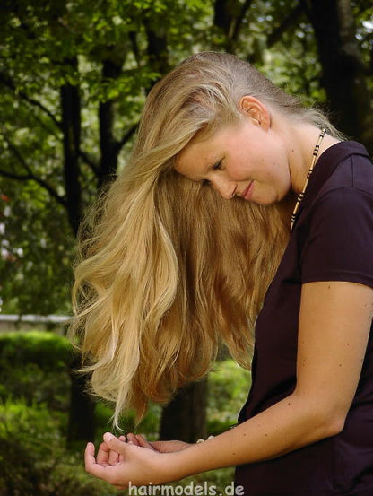 607 long blond hair by young barber shampooing and wet set