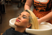 Laden Sie das Bild in den Galerie-Viewer, 1020 1 Ernita backward wash blonde bleached hair in salon bavarian folk style barberette