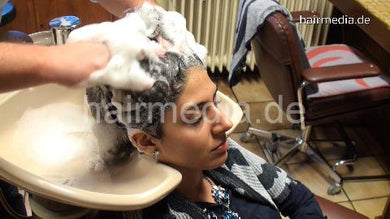 9065 Jemila 3 backward hairwash in salon by barber