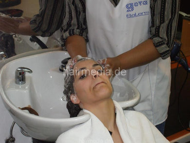 8053 Paula 1 shampooing backward by barberette in white apron
