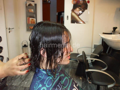 8053 Paula 2 haircut by mature barberette in white apron