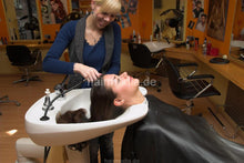 Load image into Gallery viewer, 6087 Jenia 1 wash thick hair in salon backward black shiny shampoocape
