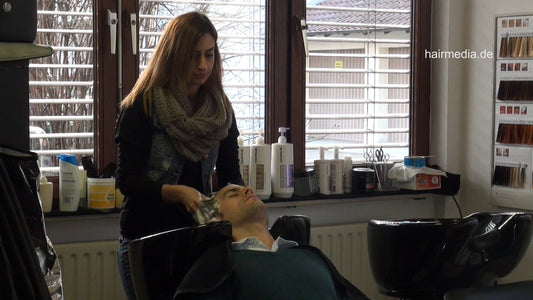 277 male client pampering backward hairwashing by long hair shampoogirl