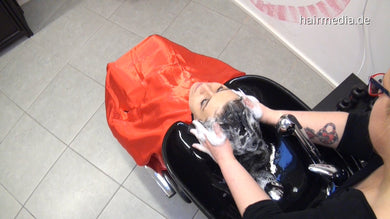 8135 Janine 1 backward shampoo in cheap red cape in blackbowl in salon
