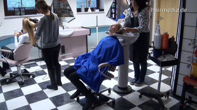 345 s1636 Charlotte teen  blonde long hair salon backward shampooing in blue cape