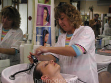 Load image into Gallery viewer, 682 Conny in Portugal 1 shampooing in salon backward shampoobowl