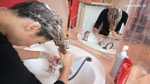 9092 Zoya 1 JM custom hair self shampooing forward in leatherpants in salon